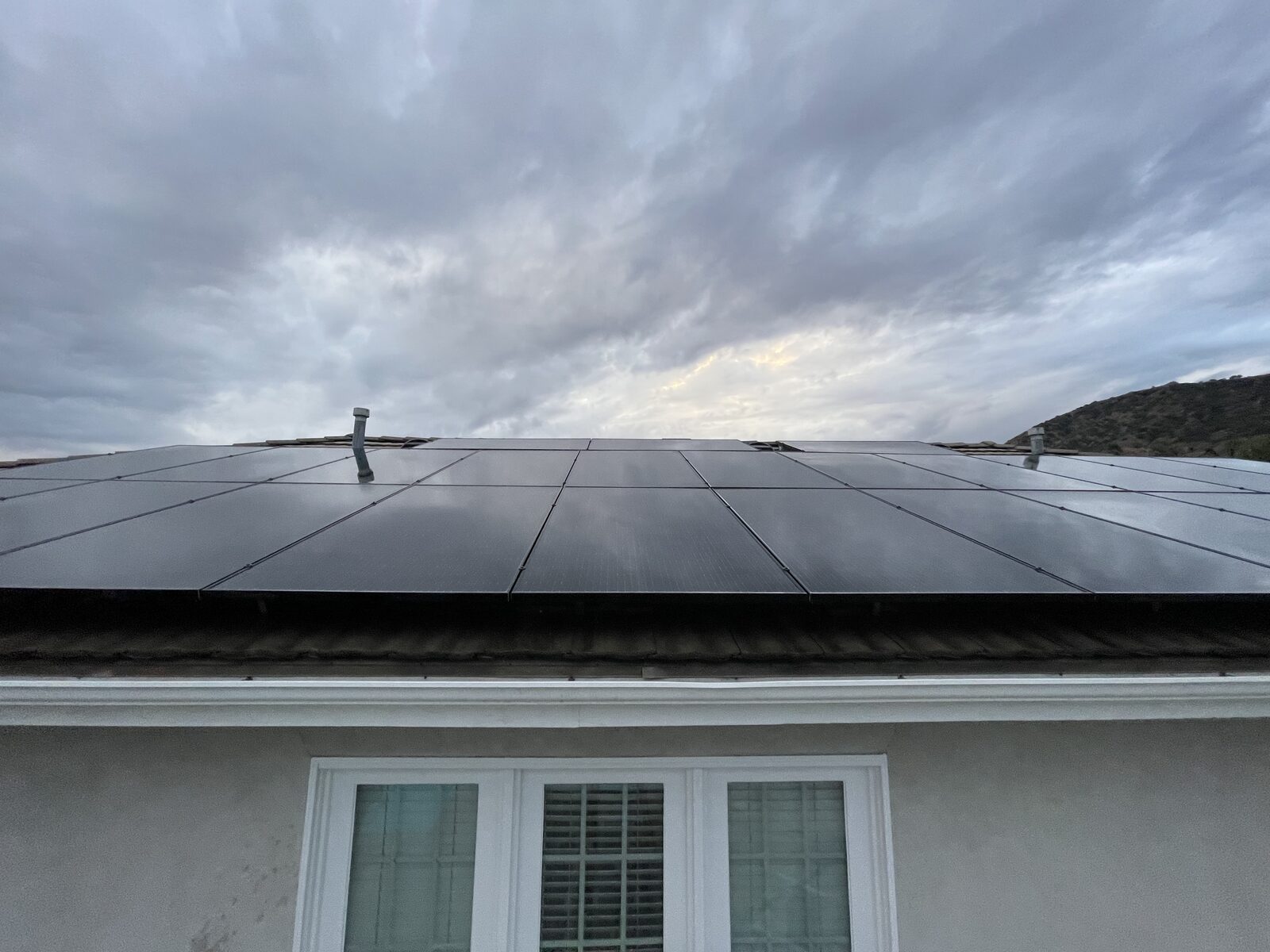 Freshly cleaned solar panels on a customer's roof